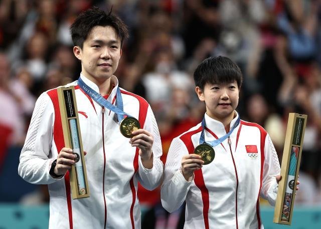 1722390909210091151.jpg 巴黎奥运会丨乒乓球——王楚钦_孙颖莎混双夺冠XxjpseC010400_20240730_MVPFN0A001.jpg
